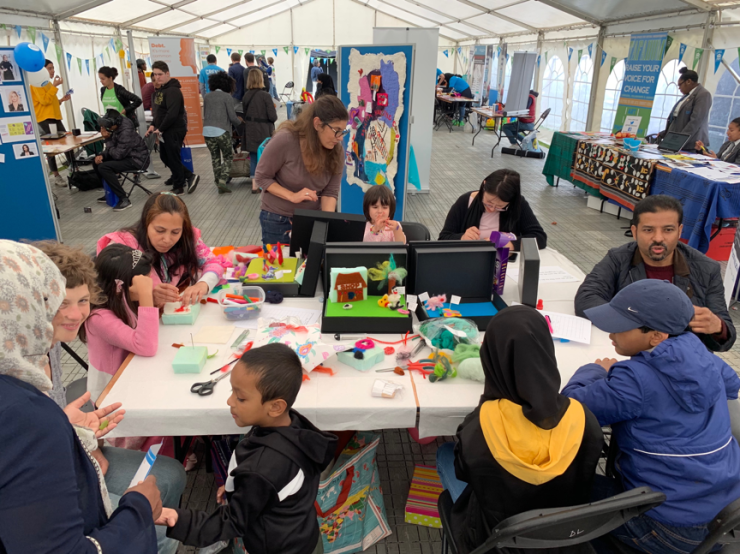 Participants making felt, drawn to the bright colours and textures.